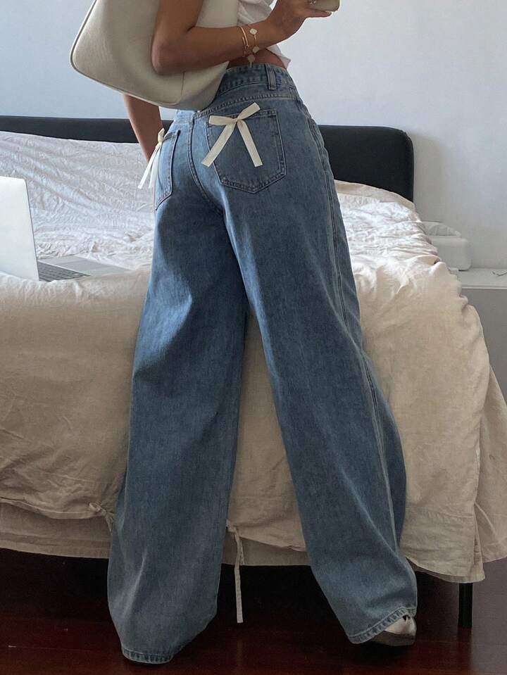 High-Waist Light Wash Wide-Leg Jeans with Bow Accent
